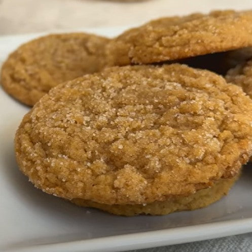 Pumpkin Snickerdoodle Cookies resting on a plate. 