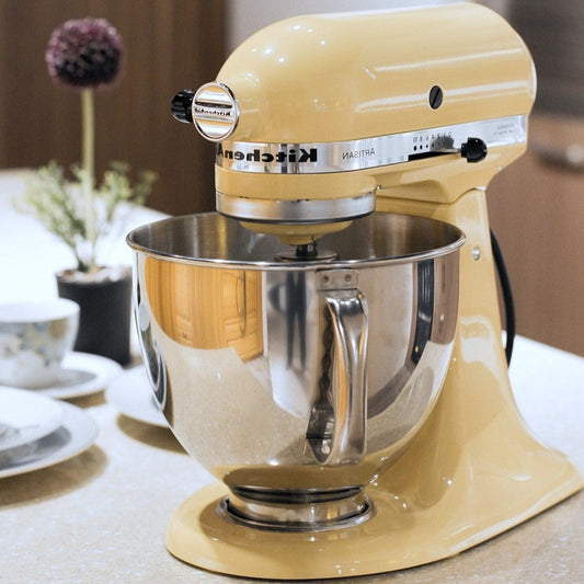 Stand mixer and baking tools, part of a home baker's essential toolkit.
